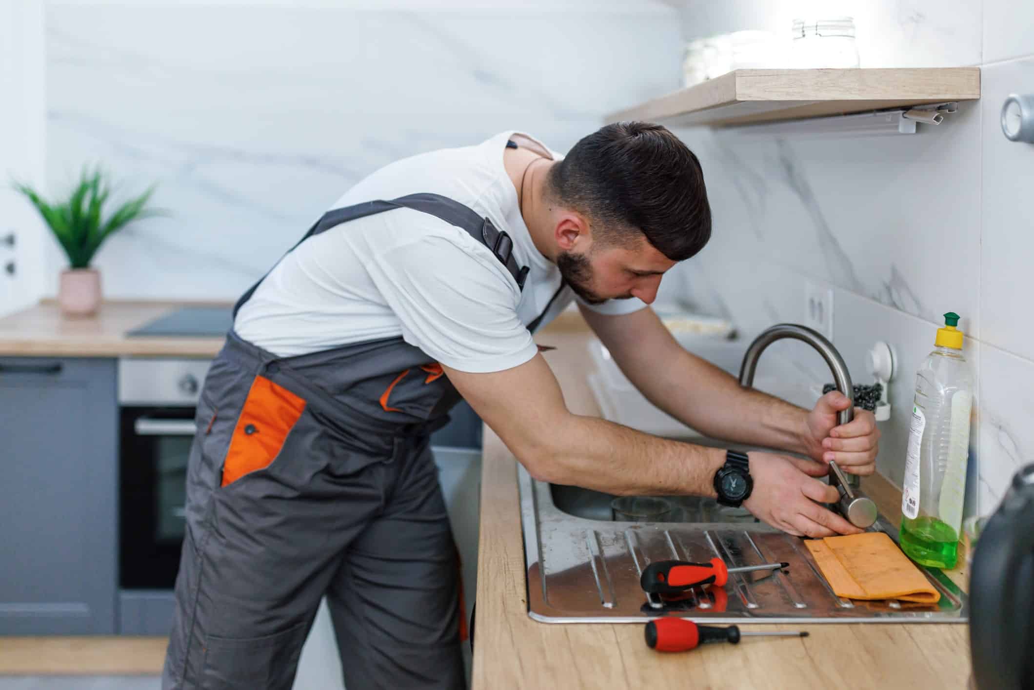 plumber repairing sink clog plumber repairing sink clog